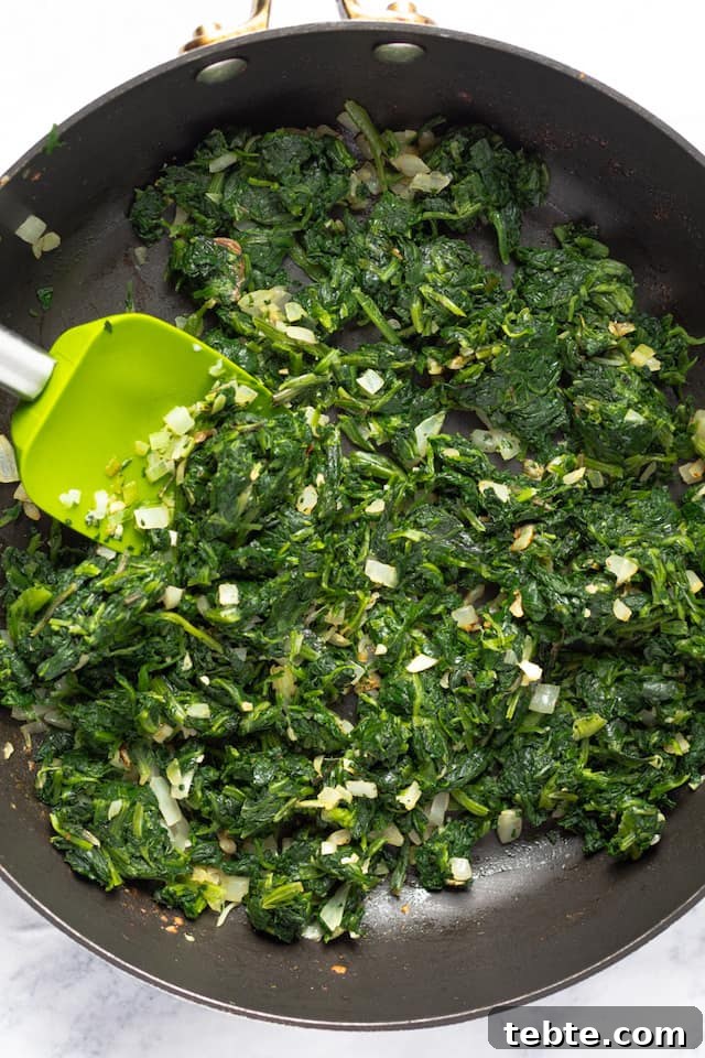 Lighter Creamed Spinach Recipe: Rich Flavor, Fewer Calories 3 healthy creamed spinach recipe cooking in pan
