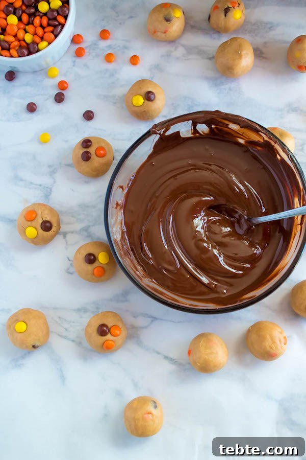 Reese’s Pieces Peanut Butter Truffle Recipe for Candy Lovers 7 Reese's Pieces Peanut Butter Truffles— smooth and creamy peanut butter balls, loaded with mini Reese's Pieces, coated with dark chocolate and drizzled with melted peanut butter!