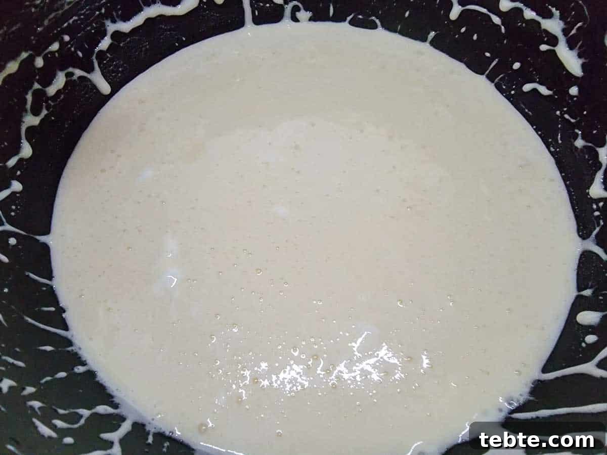 Small-Batch Rice Krispie Treats Recipe 5 milk, vanilla, and marshmallows melted in a pan.