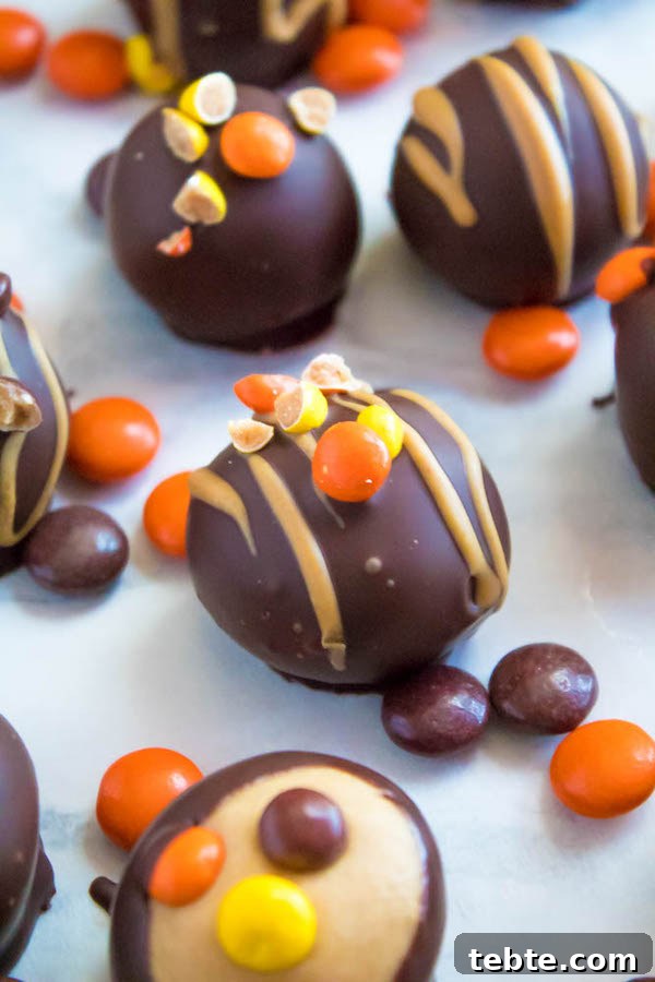 Reese’s Pieces Peanut Butter Truffle Recipe for Candy Lovers 9 Reese's Pieces Peanut Butter Truffles— smooth and creamy peanut butter balls, loaded with mini Reese's Pieces, coated with dark chocolate and drizzled with melted peanut butter!