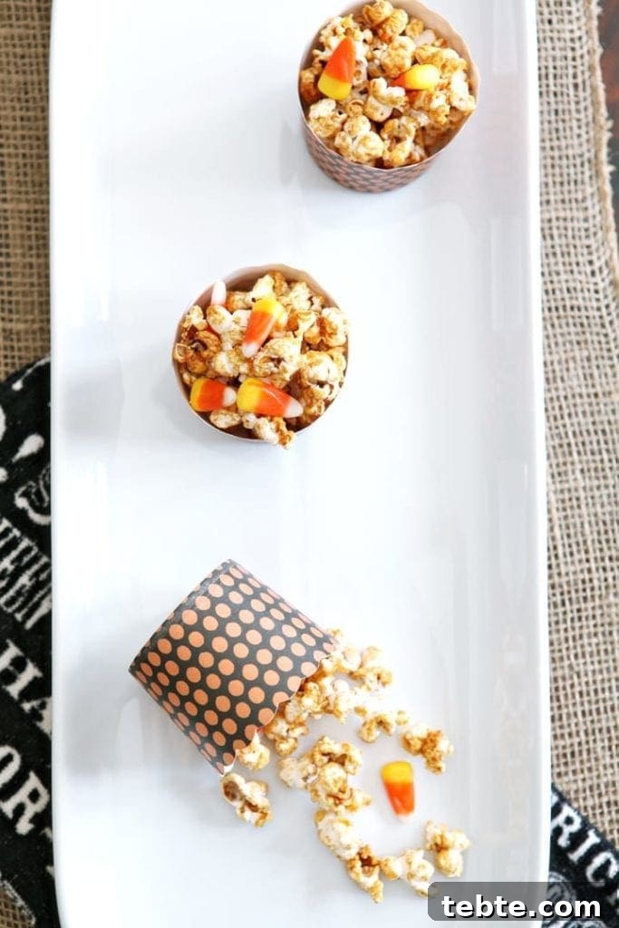 Halloween Caramel Corn Recipe: Sweet & Crunchy Party Snack 3 Overhead view of popcorn with candy corn in bowls on white serving dish