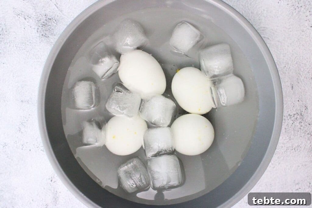 remove the cooked eggs and place them in an ice bath to cool