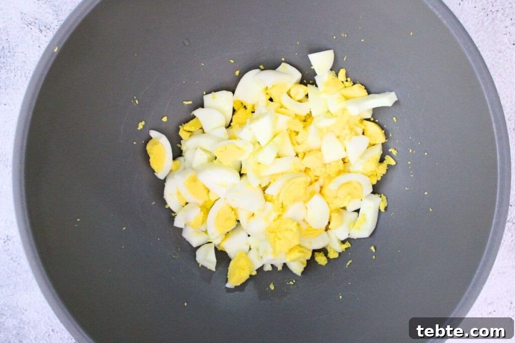 roughly chop the eggs into chunks