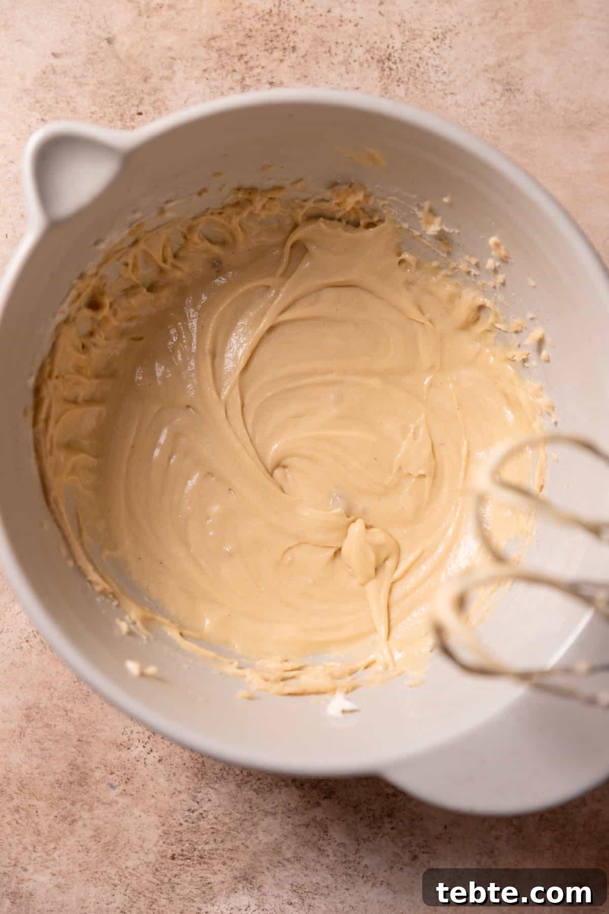 cookie batter in a bowl after adding the eggs.