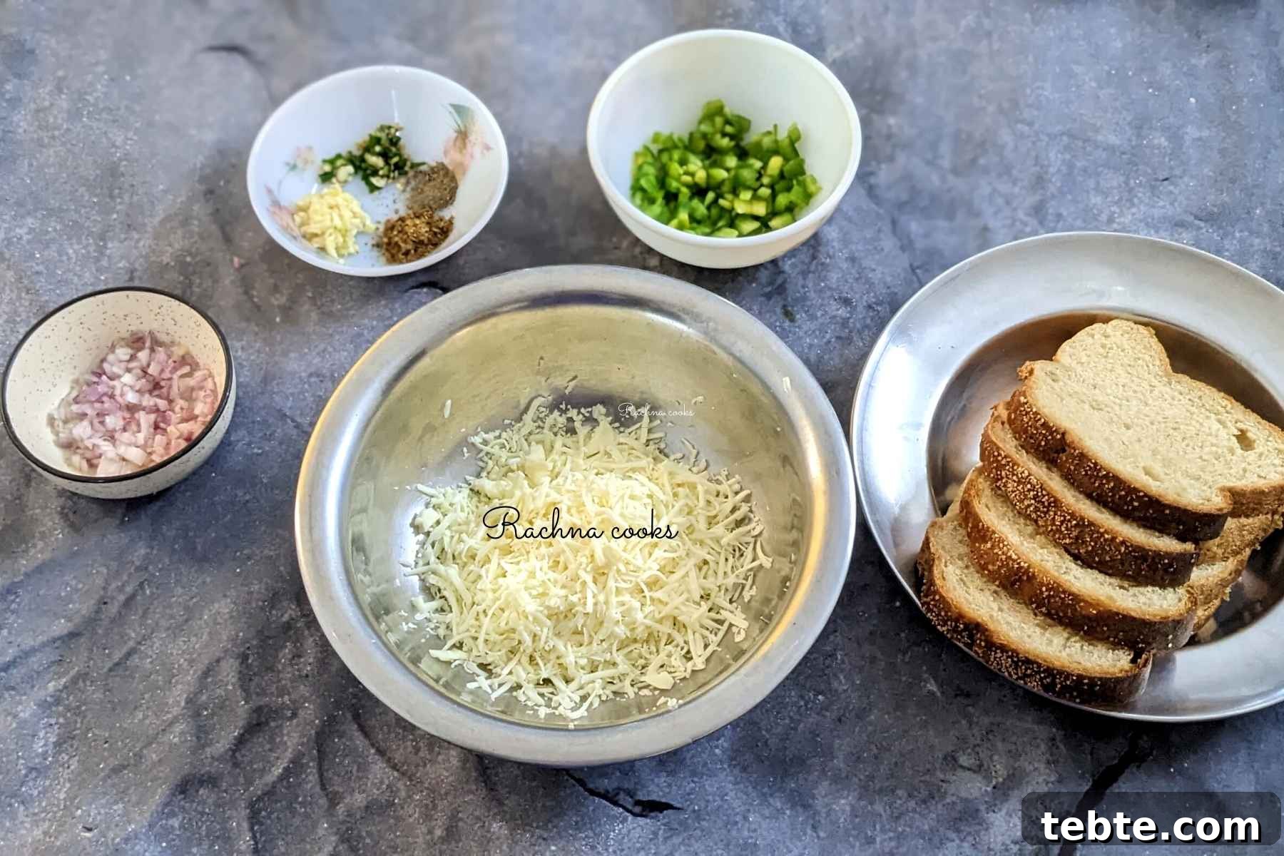 Spicy Chilli Cheese Toast Recipe for Quick Savory Snacks 3 Ingredients to make chilli cheese toast in bowls: cheese, bread slices, chopped onion, bell pepper, garlic, chillies, pepper and Italian seasoning.