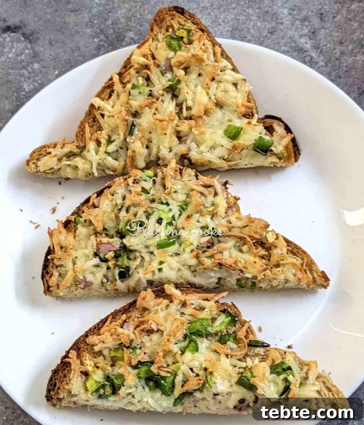 Spicy Chilli Cheese Toast Recipe for Quick Savory Snacks 4 3 chilli cheese toast slices in halves on a white plate