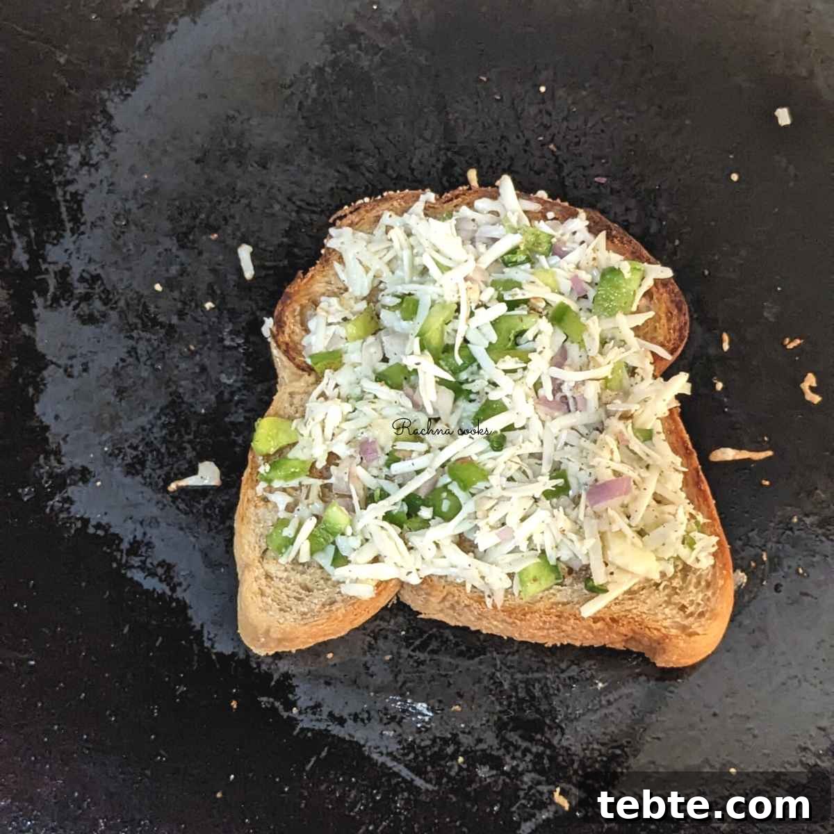Spicy Chilli Cheese Toast Recipe for Quick Savory Snacks 7 One chilli cheese toast on a skillet