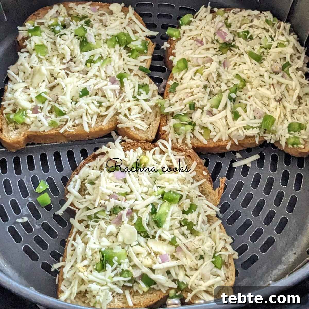 Spicy Chilli Cheese Toast Recipe for Quick Savory Snacks 8 3 slices chilli cheese toast in air fryer basket ready for air frying.