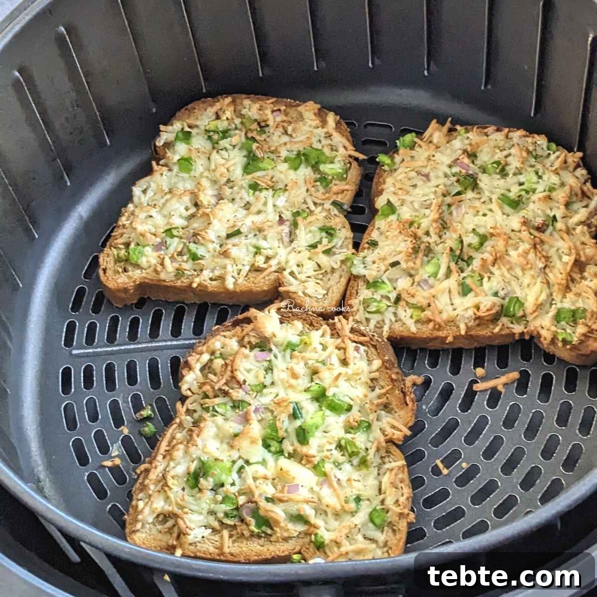 Spicy Chilli Cheese Toast Recipe for Quick Savory Snacks 9 3 slices chilli cheese toast in air fryer basket after air frying.