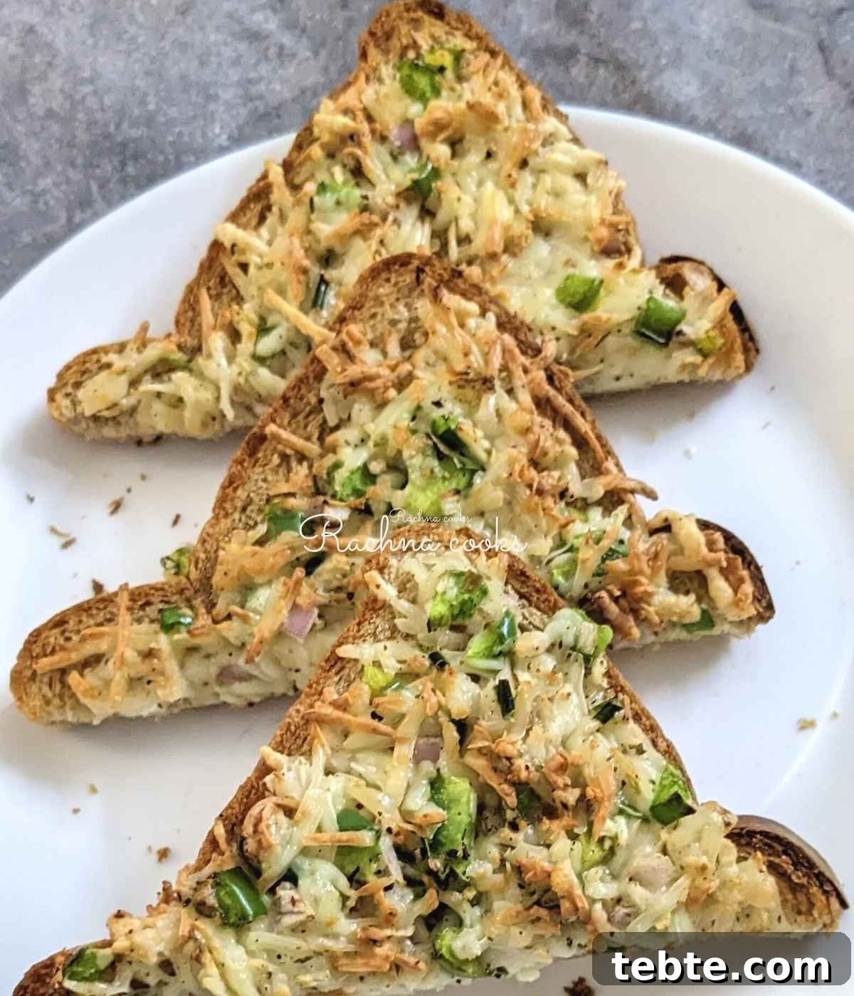 Spicy Chilli Cheese Toast Recipe for Quick Savory Snacks 10 3 chilli cheese toast slices in halves on a white plate