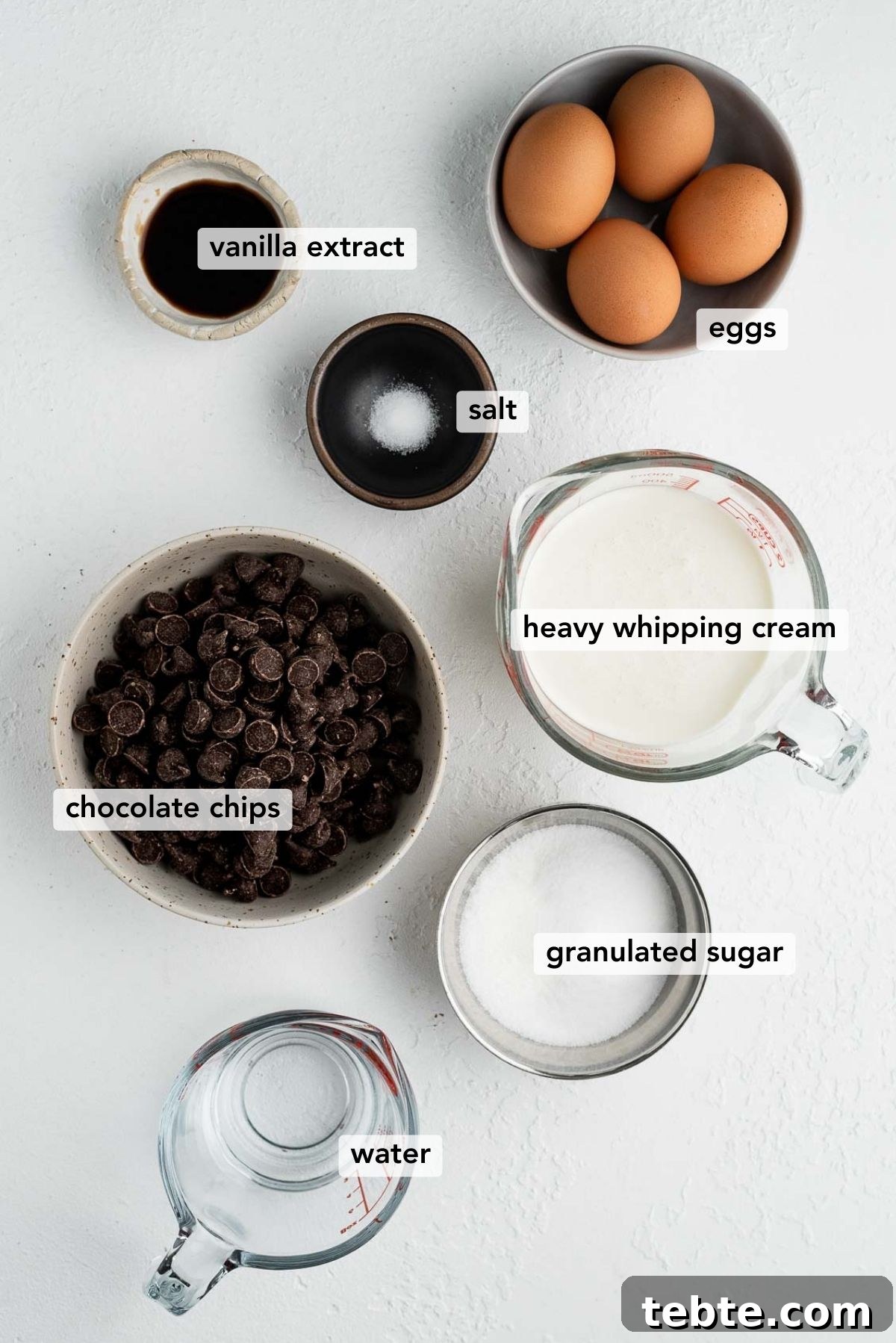 Silky Blender Chocolate Mousse Recipe You Can Make in Minutes 3 Ingredients needed to make easy blender chocolate mousse on white textured background.