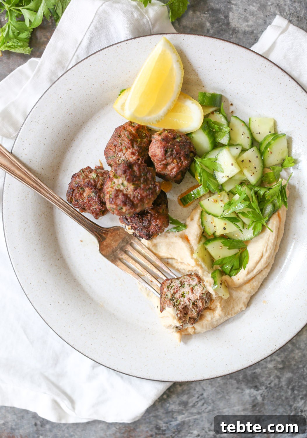 Overhead close-up of the interior of a spiced lamb meatball. 