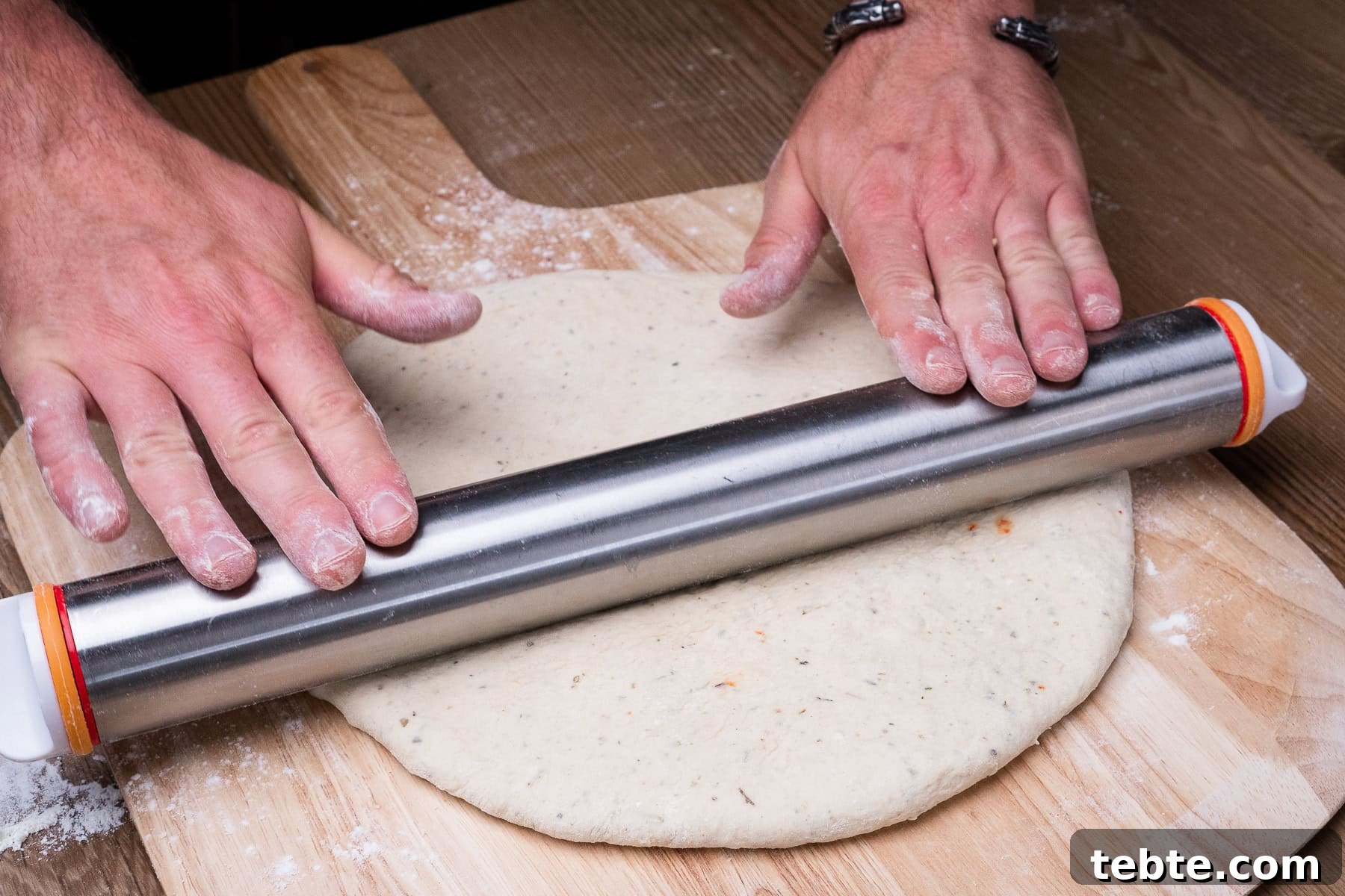 Crispy Garlic Pizza Bread Recipe — Cheesy Garlic Pull-Apart Loaf 27 Rolling out the pizza bread dough flat with a rolling pin