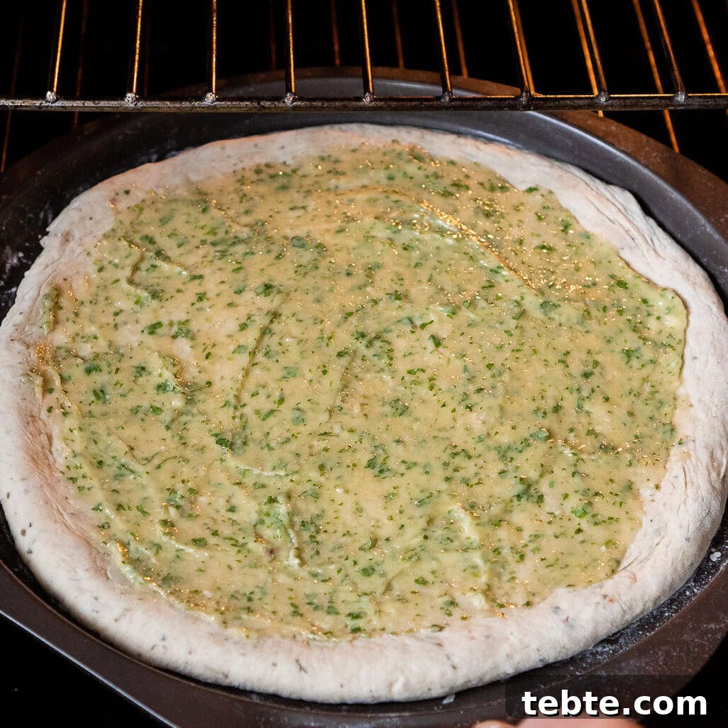 Crispy Garlic Pizza Bread Recipe — Cheesy Garlic Pull-Apart Loaf 31 Placing the Garlic Pizza Bread in the oven to be cooked