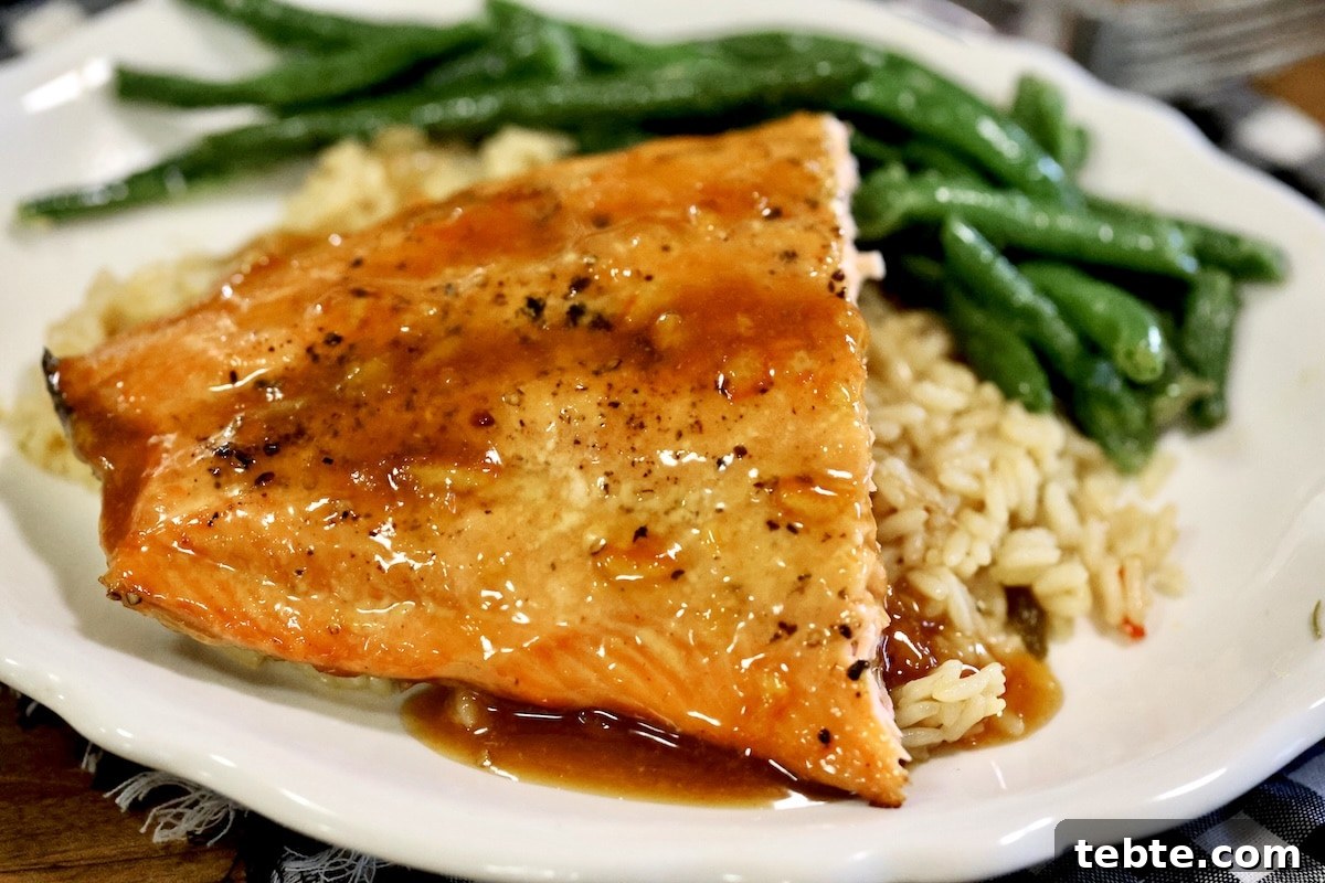 Orange Glazed Salmon Recipe with Citrus Soy Glaze 2 Orange glazed salmon with green beans and rice.