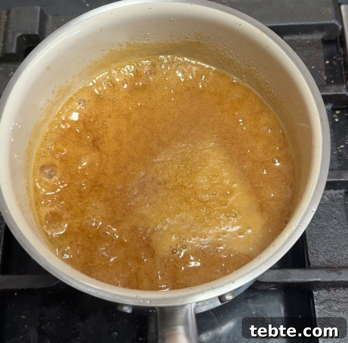 Orange Glazed Salmon Recipe with Citrus Soy Glaze 4 Pan of bubbling orange sauce.