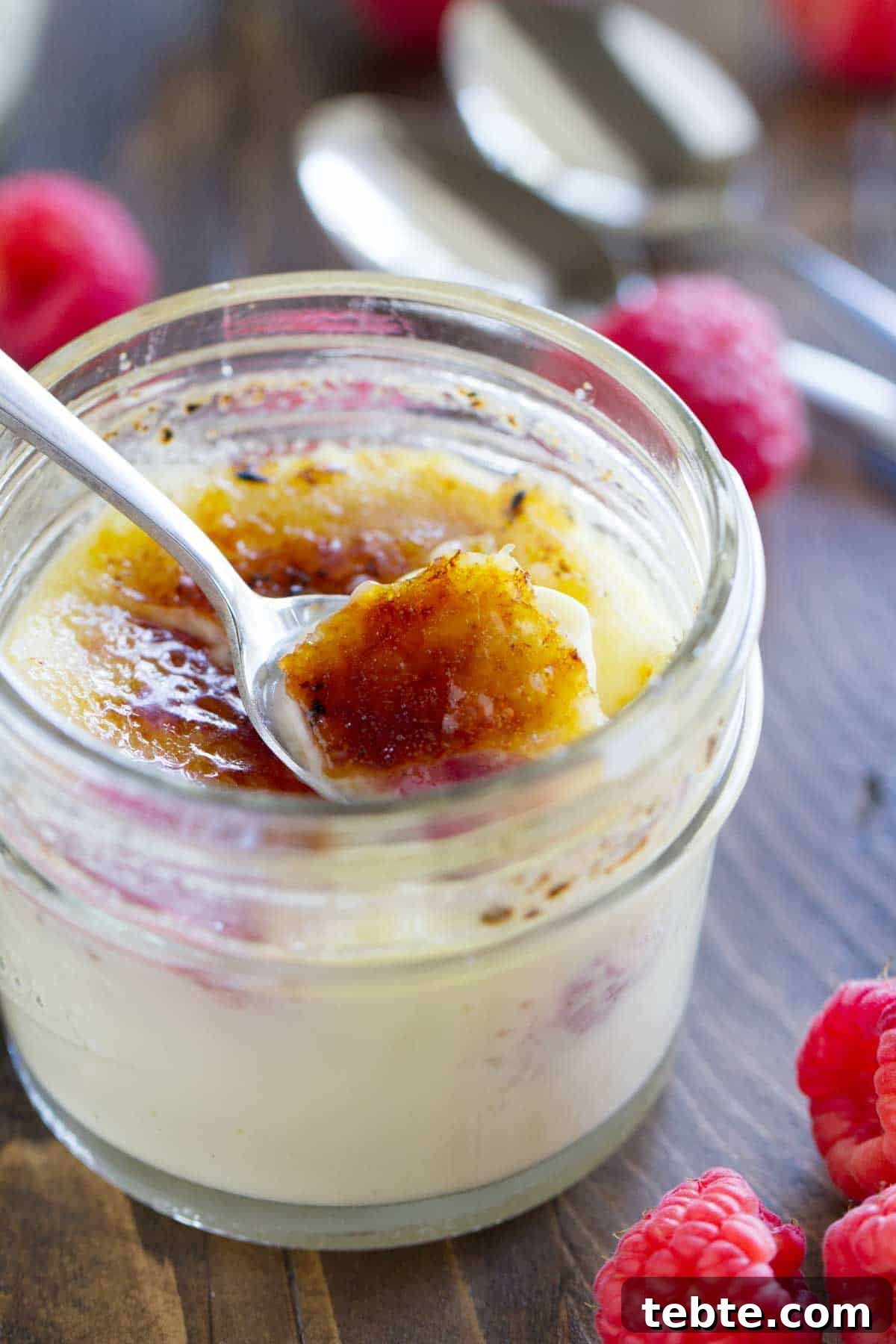 Breaking through the sugar on Raspberry Creme Brûlée.