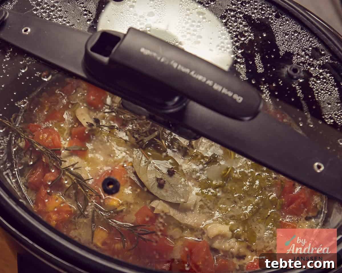 Slow-Cooker French Ham Steak Stew Recipe 8 A lid on a slow cooker with ham steaks and sauce