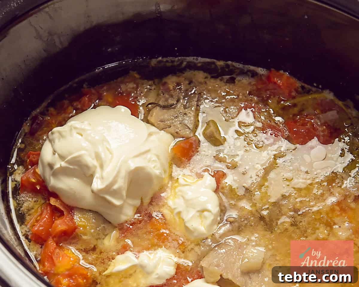 Slow-Cooker French Ham Steak Stew Recipe 9 Heavy cream added to the slow cooker with ham and a flavorful sauce.