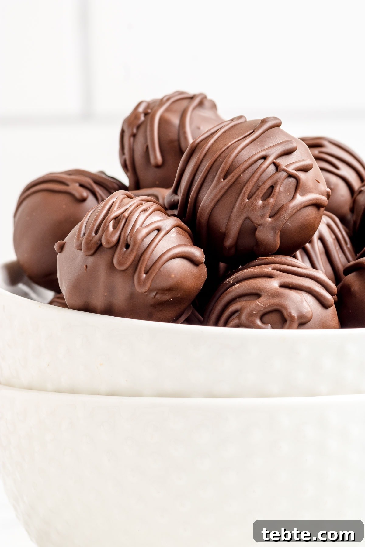 No-Bake Chocolate-Covered Cookie Dough Truffles 14 truffles in a bowl