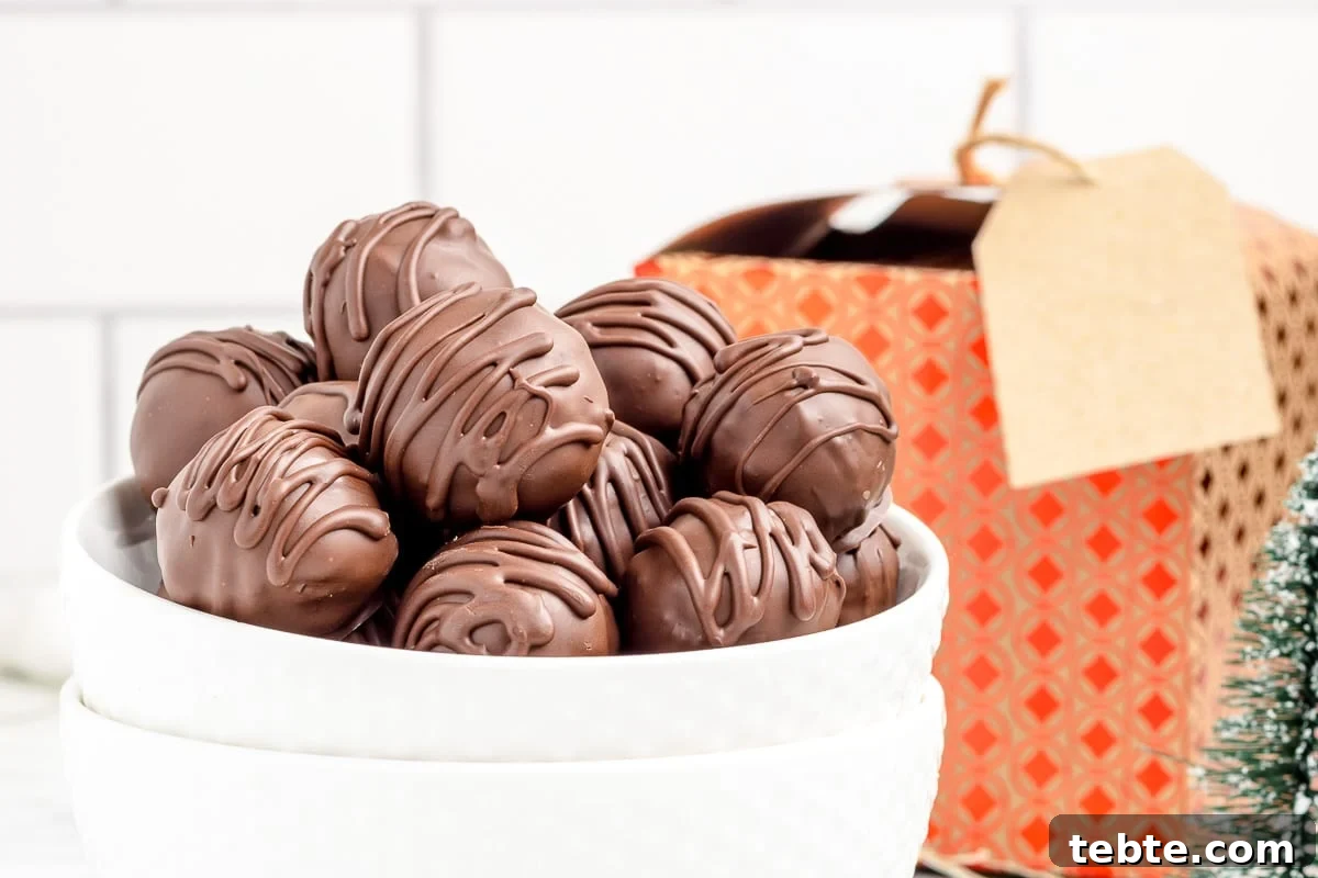 No-Bake Chocolate-Covered Cookie Dough Truffles 3 Cookie dough bites in a bowl