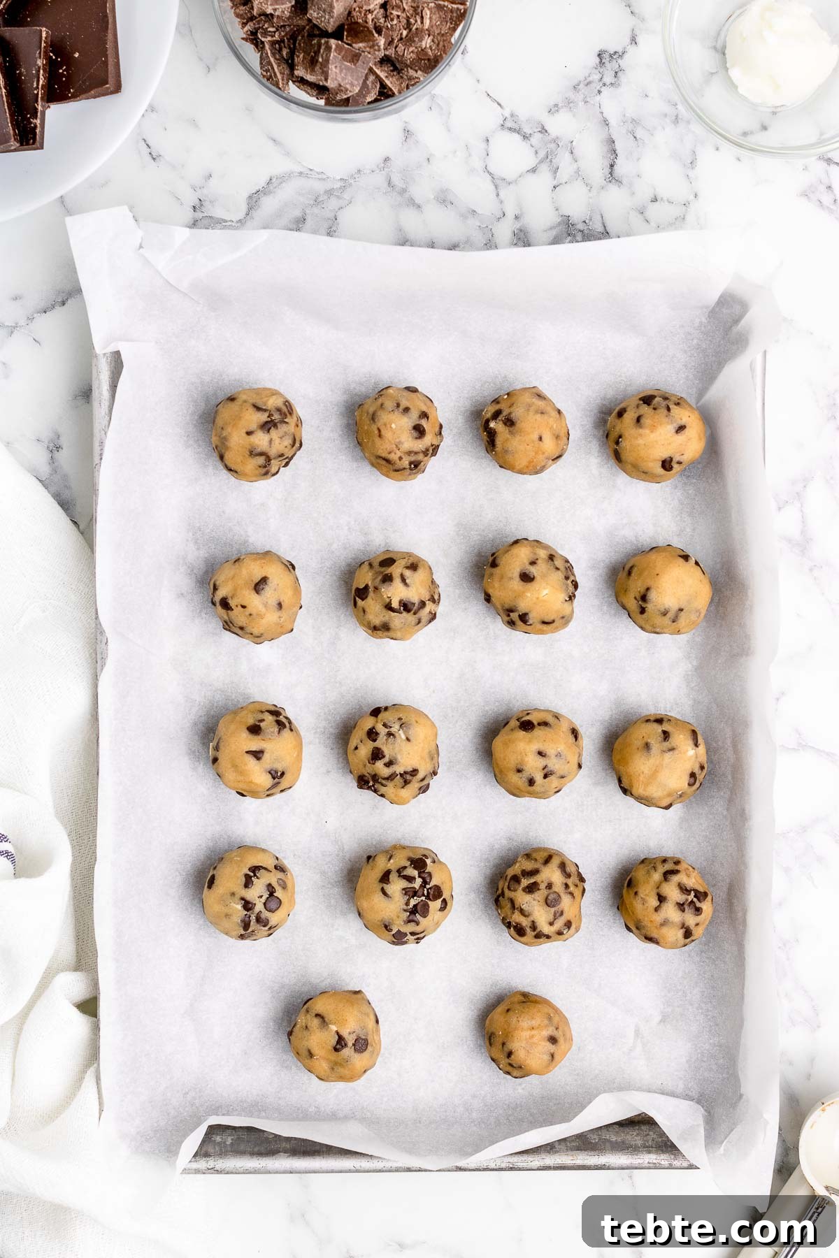 No-Bake Chocolate-Covered Cookie Dough Truffles 7 cookie dough balls on a pan