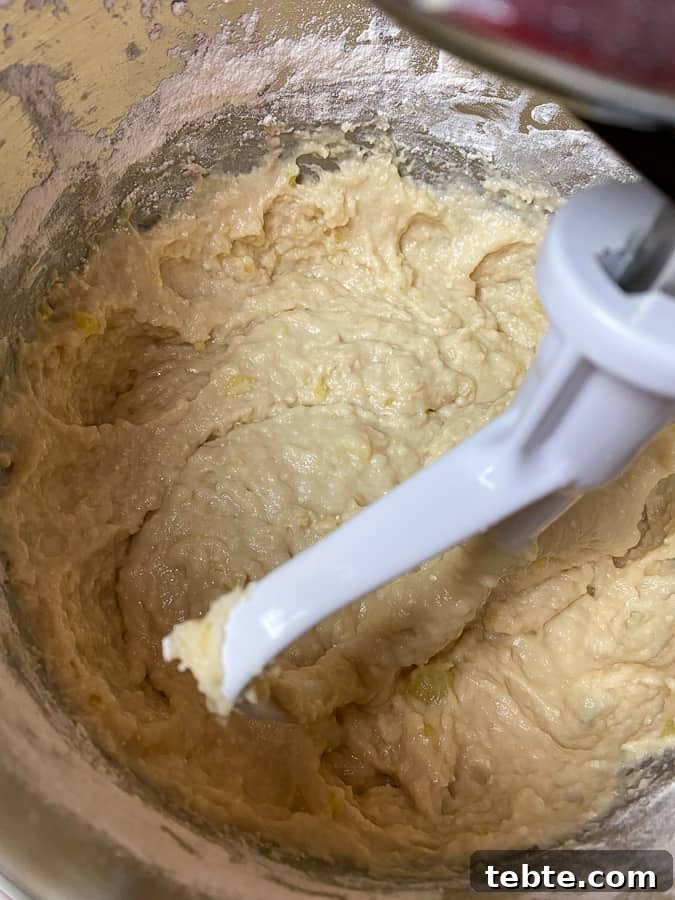 Classic Old-Fashioned Cinnamon Rolls Recipe for Soft, Gooey Buns 8 mashed potatoes added to mixing bowl to make cinnamon roll dough