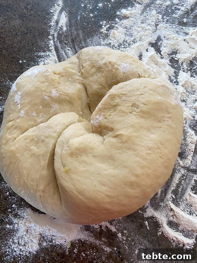 Classic Old-Fashioned Cinnamon Rolls Recipe for Soft, Gooey Buns 10 Ball of old fashioned cinnamon roll dough being kneaded
