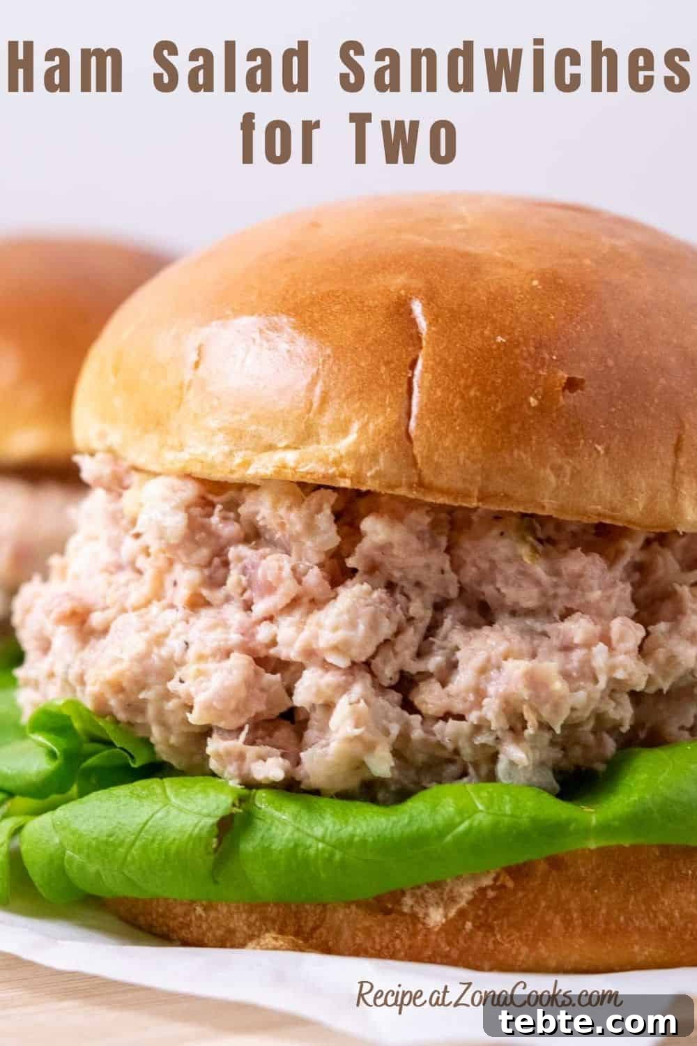 Classic Ham Salad Sandwich Recipe for Quick Lunch Ideas 8 a sandwich roll filled with lettuce and ham salad spread and text reading ham salad sandwiches for two recipe at zonacooks.com