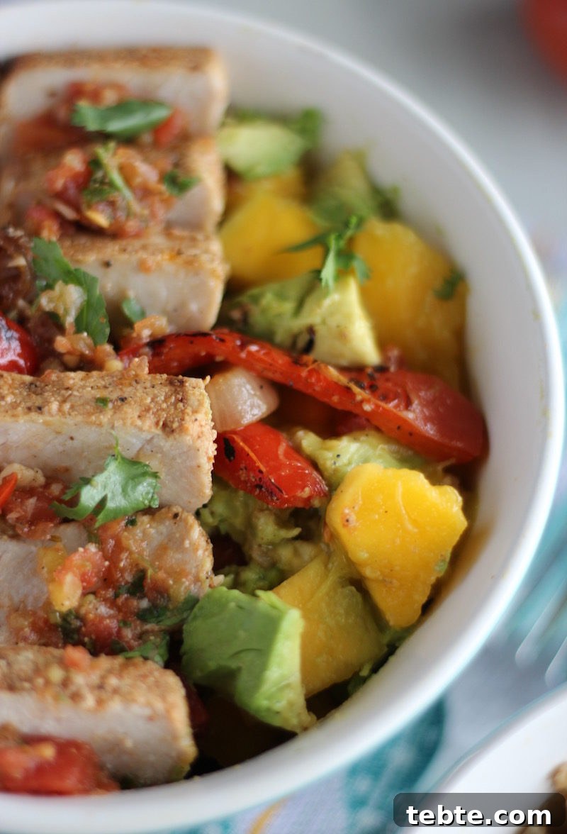 Grilled Pork Burrito Bowls - loaded cauliflower rice bowls are packed with tender pork, sweet mango guac, fresh salsa, and grilled veggies! Oh my YUM. | fedandfulfilled.com