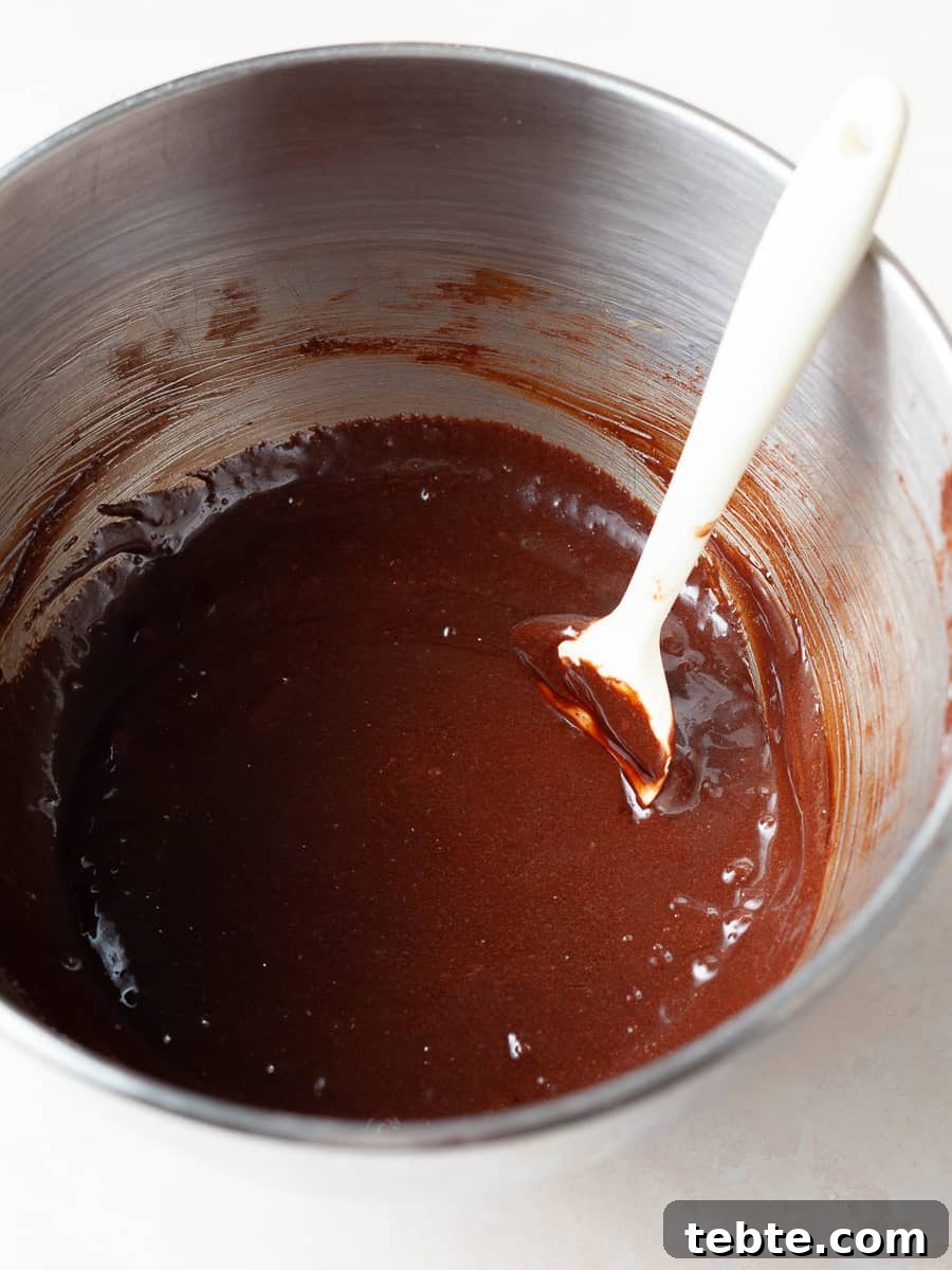 Gluten-Free Pumpkin Cheesecake Brownies Recipe for Fall Baking 11 gluten free brownie batter in a mixing bowl