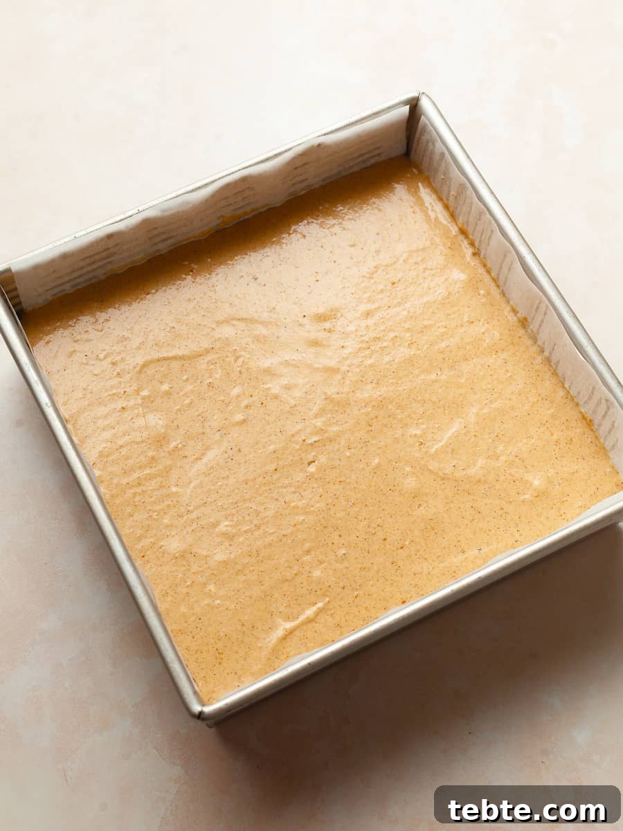 Gluten-Free Pumpkin Cheesecake Brownies Recipe for Fall Baking 17 gluten free pumpkin cheesecake brownies in a baking pan before being baked