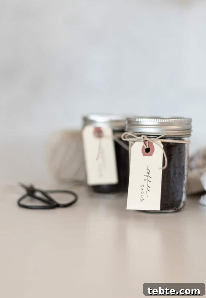 Coconut Coffee Scrub DIY: Glow-Boosting Body & Face Exfoliant 2 2 jars of DIY Coconut Coffee Scrub sitting on counter.