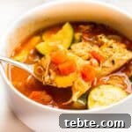 Chicken minestrone soup with a spoon