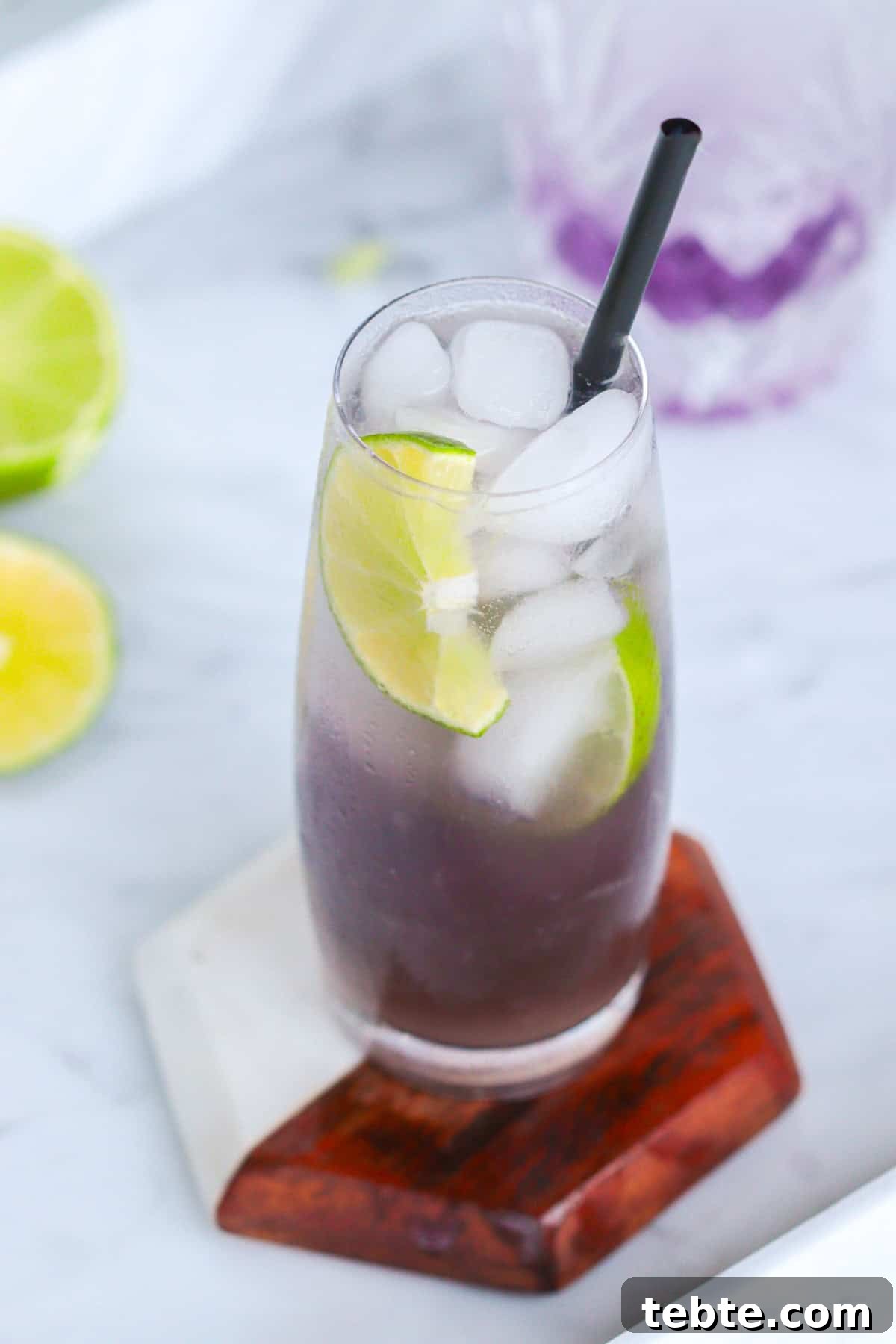 12 Crème de Violette Cocktails to Try Tonight 4 Stormy morning cocktail with lime slices.