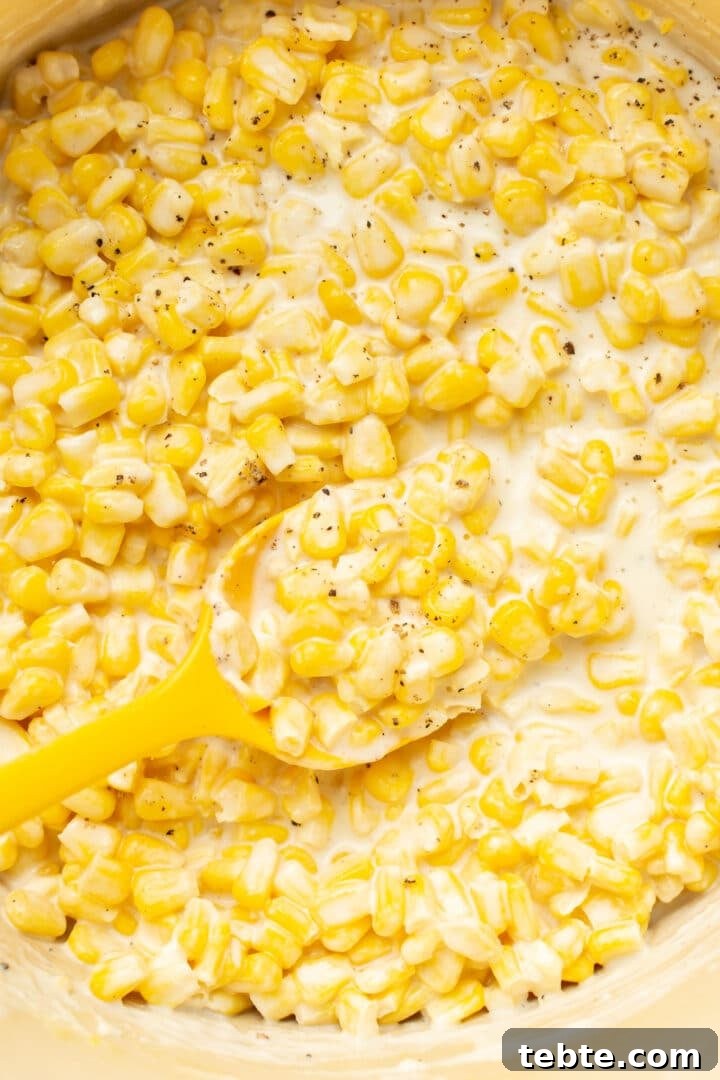 Creamy Southern-Style Creamed Corn Recipe 6 closeup of creamed corn with a spoon