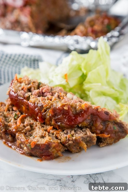 Classic Comfort Meatloaf Recipe with Savory Glaze 2 A close up of a plate of food, with Meatloaf and Dinner