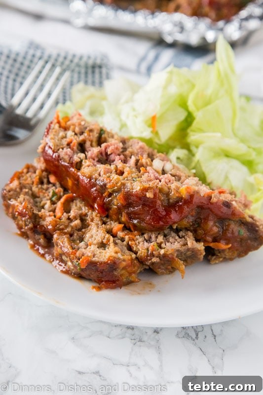 Classic Comfort Meatloaf Recipe with Savory Glaze 4 A plate of food, with Meatloaf and Dinner