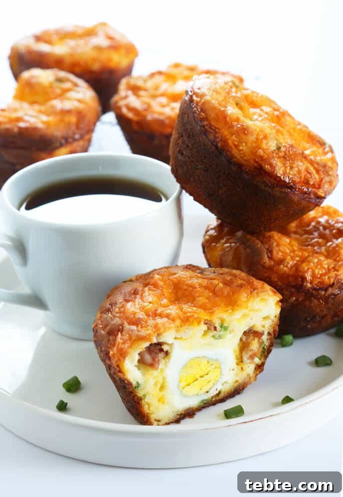 Gluten-Free Bacon & Egg Muffins: Low-Carb Breakfast Recipe 2 A close up the inside of a breakfast muffin with bacon and egg on a white plate with a cup of coffee