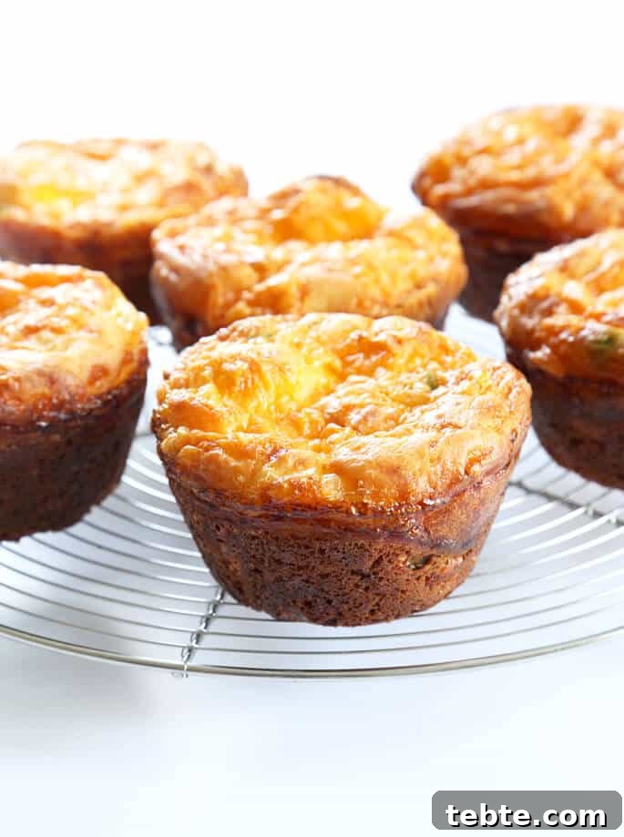 Gluten-Free Bacon & Egg Muffins: Low-Carb Breakfast Recipe 4 Breakfast muffins with bacon and egg on a metal tray