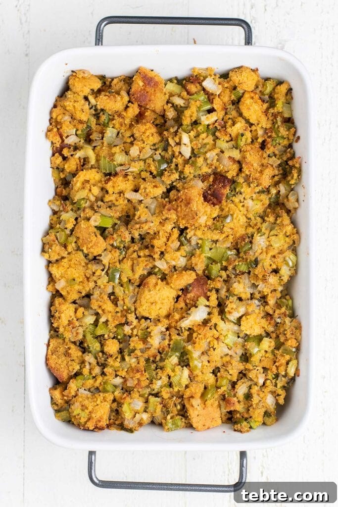 Southern Cornbread Dressing Recipe for Holiday Tables 7 A casserole dish showing a cornbread stuffing that's been baked and browned on the top.