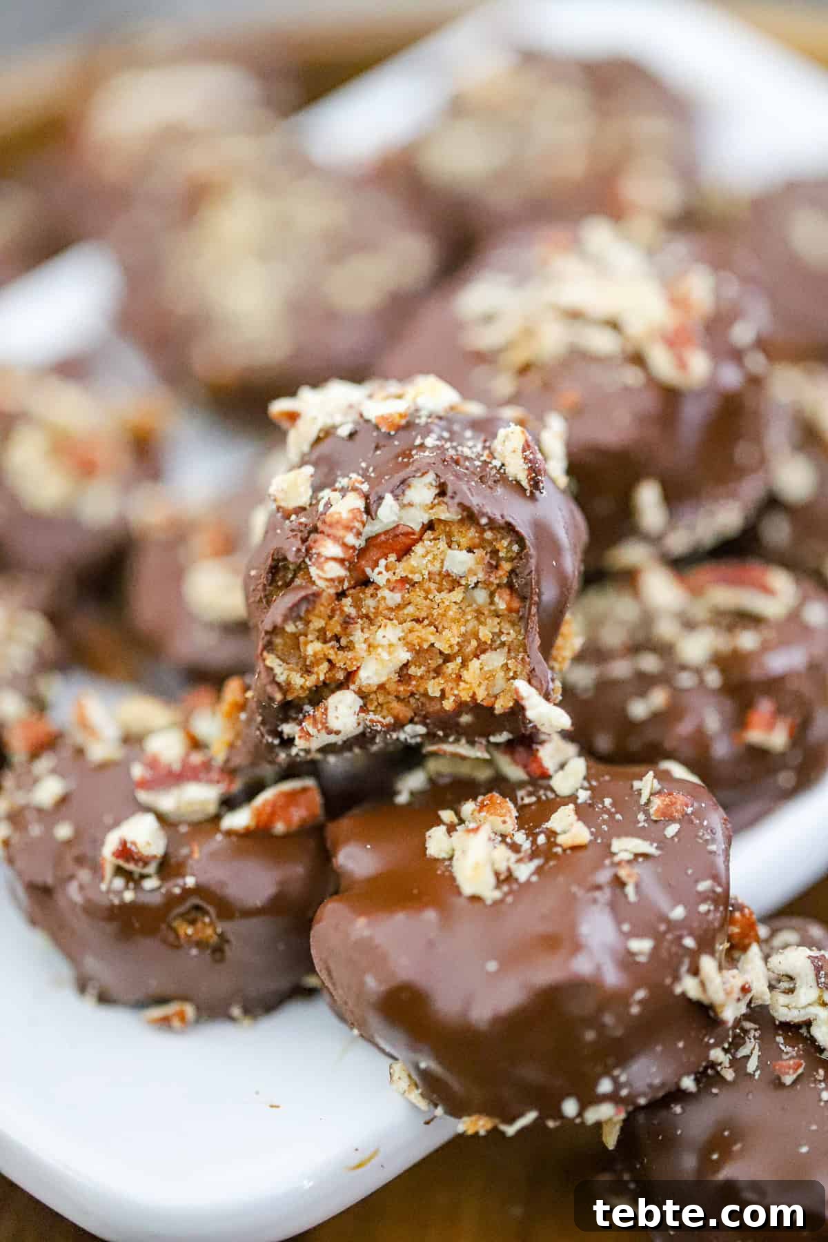 Pecan Pie Truffles Recipe — Decadent No-Bake Holiday Bites 2 pecan pie truffles on a tray