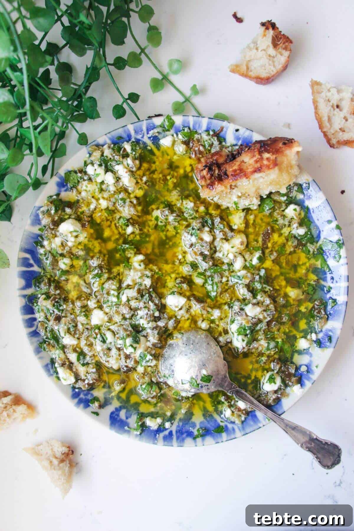 Jalapeño Popper Bread with Creamy Dipping Oil Recipe 2 Jalapeno popper bread dipping oil on a blue and white patterned plate.