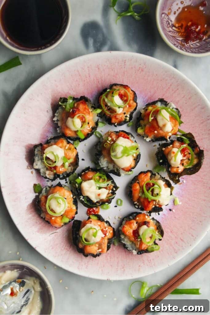Jalapeño Popper Bread with Creamy Dipping Oil Recipe 12 Salmon sushi cups on a pink plate, with aioli and sweet chilli on the side.