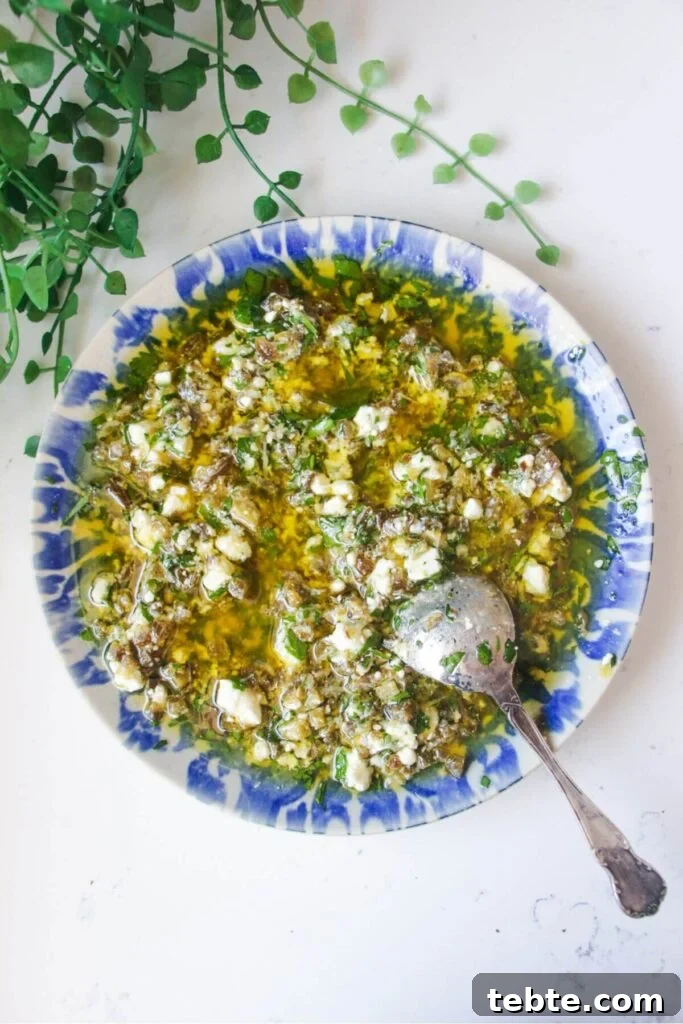 Jalapeño Popper Bread with Creamy Dipping Oil Recipe 5 Jalapeno popper bread dipping oil on a blue and white patterned plate.