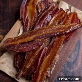 Crispy Smoked Bacon with Maple Glaze Recipe and Tips 7 Smoked Bacon slices on a cutting board