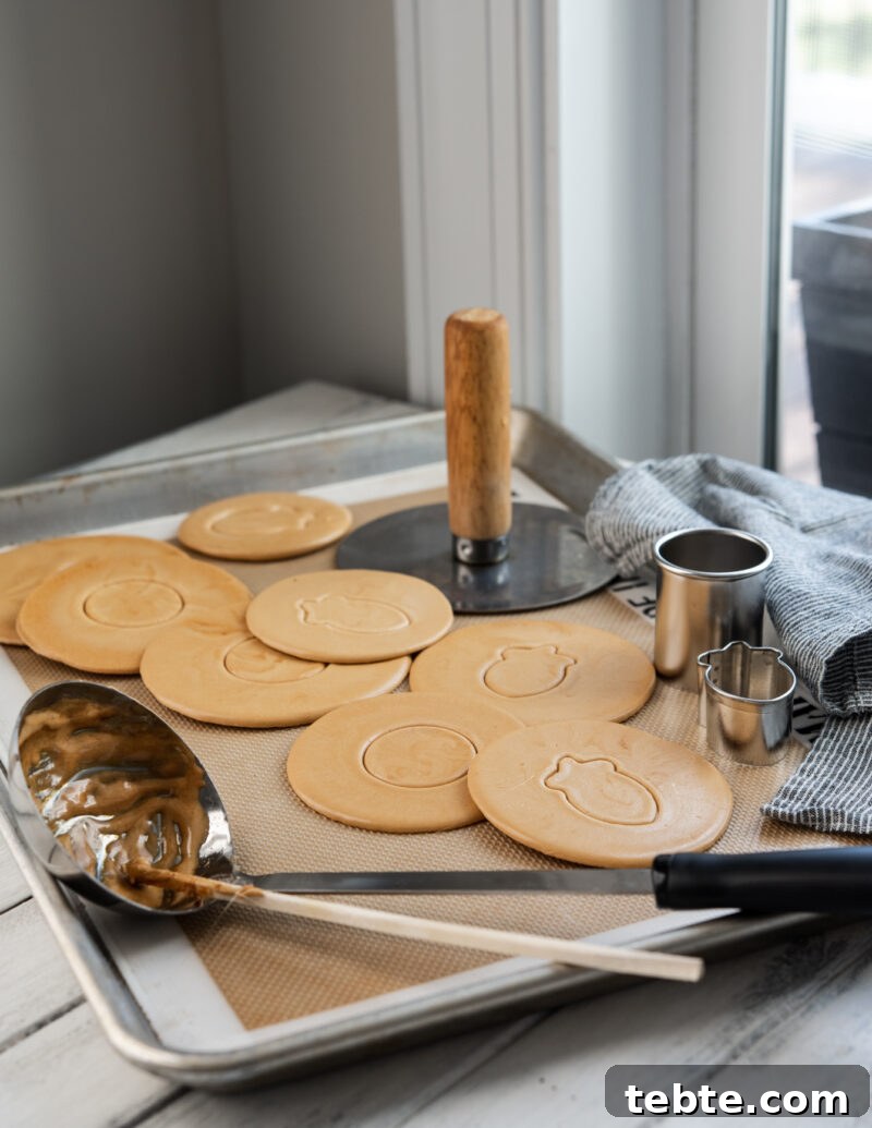 5-Minute Dalgona Candy Recipe: Crispy Korean Sugar Treat 2 Dalgona, Korean sugar candy, and a soup ladle are shown with cookie cutters.