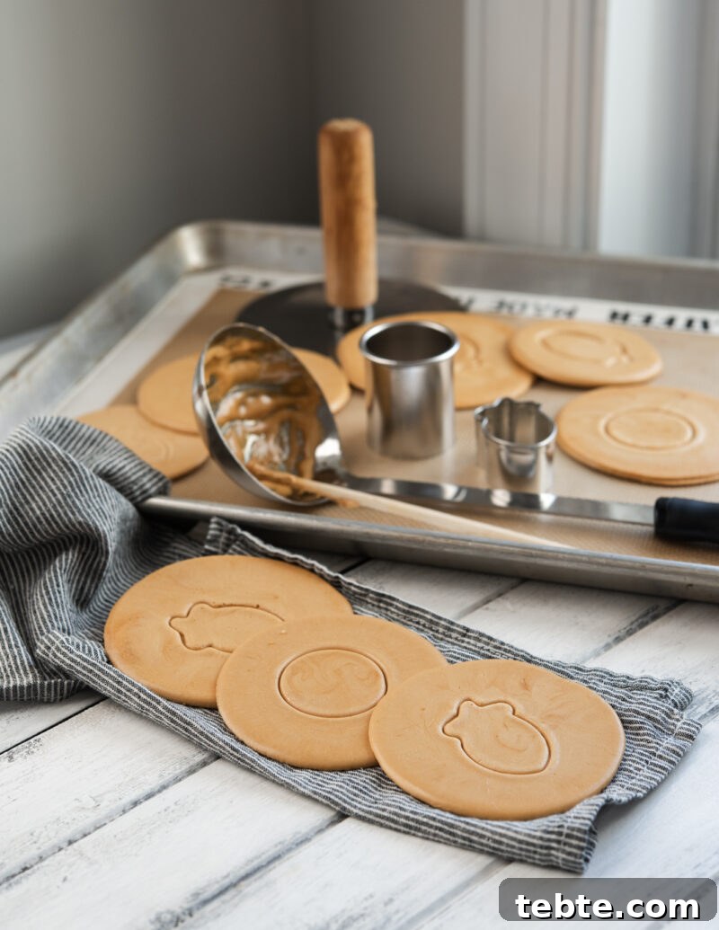 5-Minute Dalgona Candy Recipe: Crispy Korean Sugar Treat 3 Korean Dalgona candies are pressed with different patterns of cookie cutters.