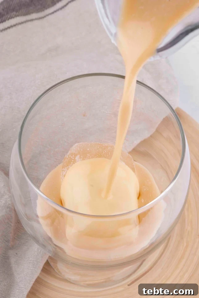 Photo of some vegan Baileys being poured into a glass