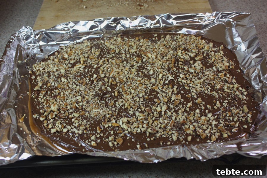 Classic English Toffee Recipe: Crispy, Buttery Homemade Treat 6 English toffee in a foil lined baking sheet.